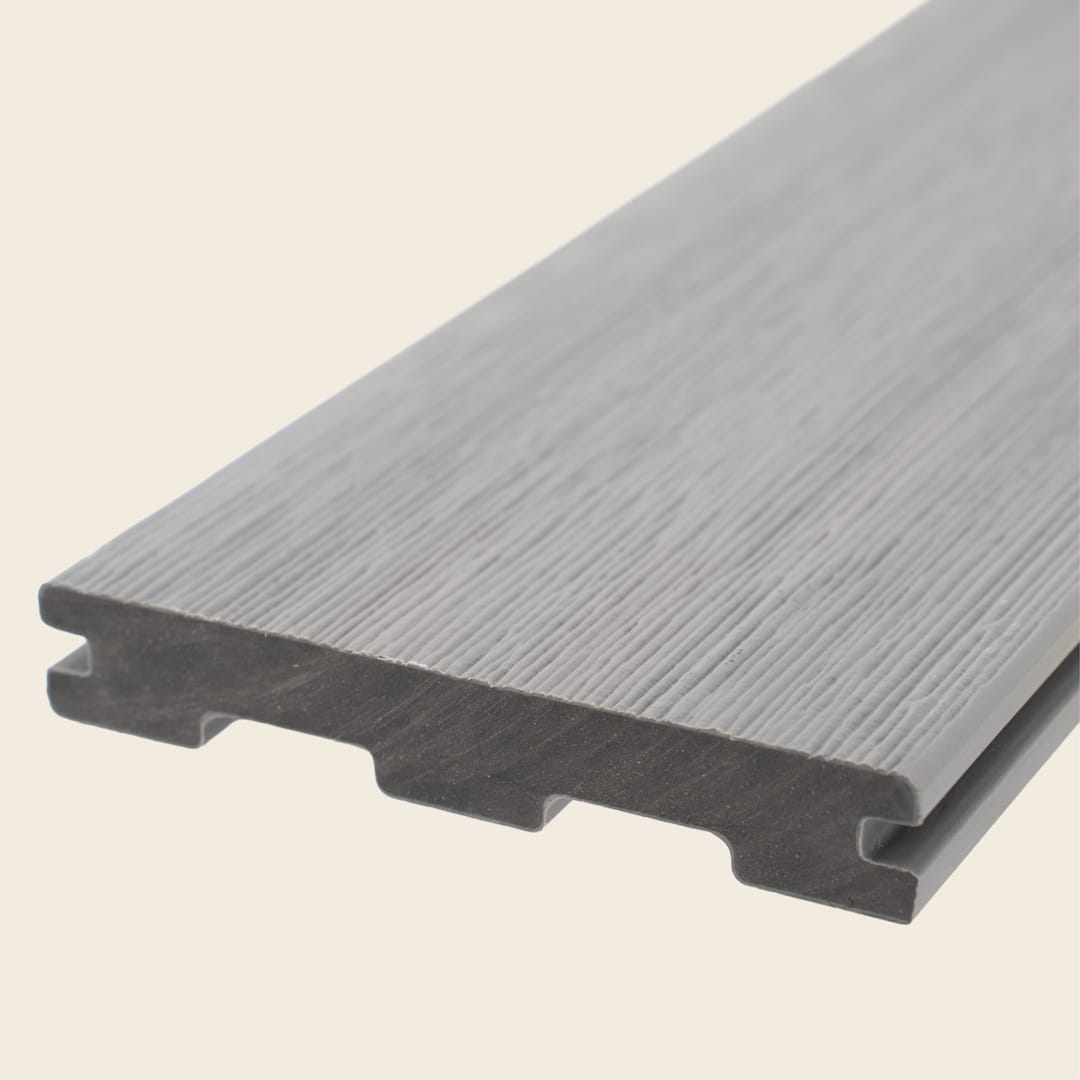 WoodEvo HOME grooved composite decking board in Hampton, a mid silver-grey, shown end-on on a cream background