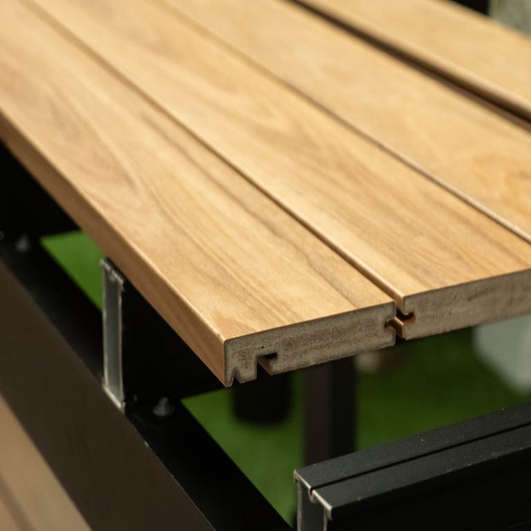 Close-up of an Origin Blackbutt composite nosing board on a deck edge, showing the printed blackbutt grain and grooved side