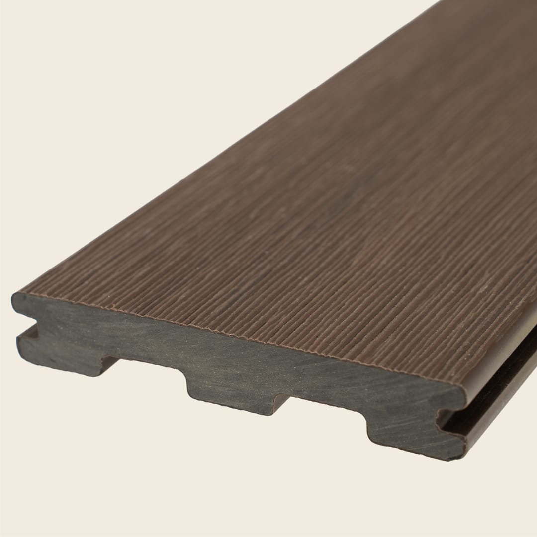 WoodEvo HOME grooved composite decking board in Teak, a dark chocolate brown with fine grain, shown end-on on a cream background