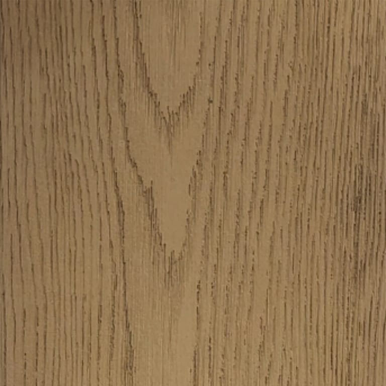 Full-frame close-up of an INNODECK board in Buttered Oak, a golden honey surface with deep embossed oak grain