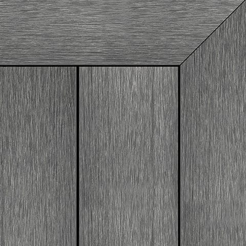 Close-up of Brite NextGen Titanium composite deck boards in Graphite, a dark grey brushed grain, with a mitred picture-frame corner
