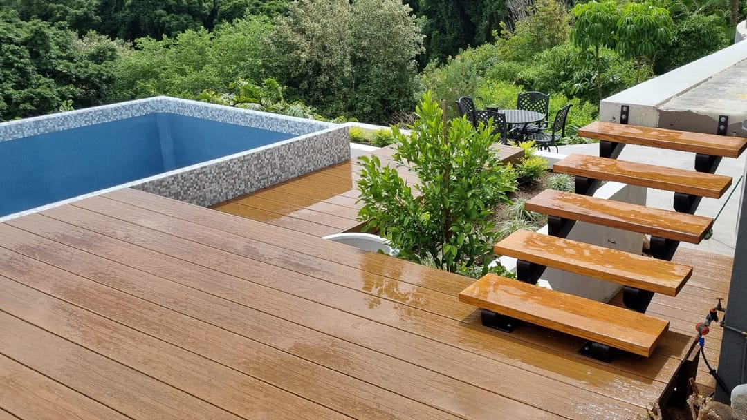 NewTechWood Coastal Teak deck with floating timber steps beside a plunge pool and garden
