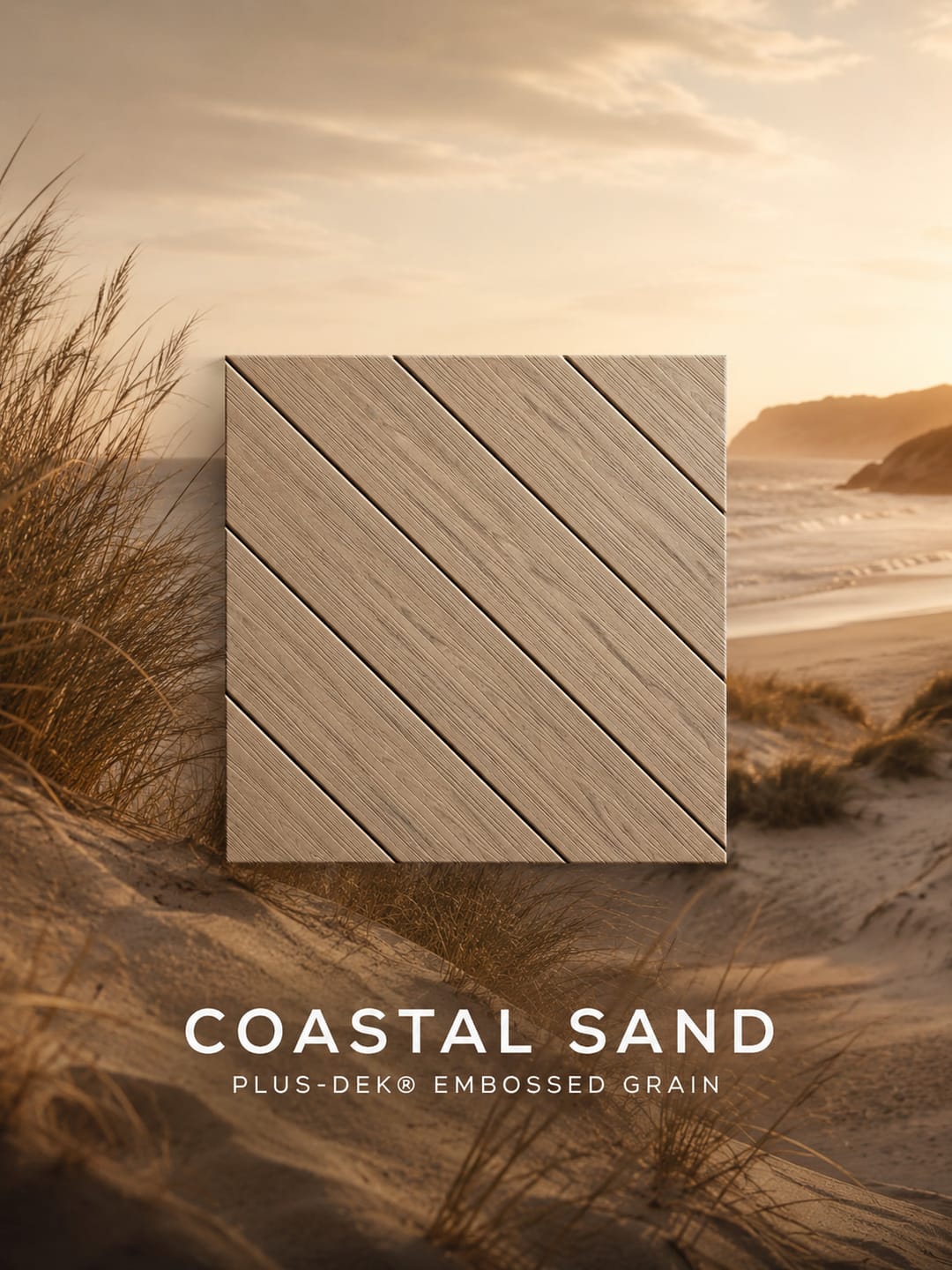PLUS-DEK Embossed Grain colour card: a light sandy beige Coastal Sand board sample shown over a dune landscape, labelled with the colour name
