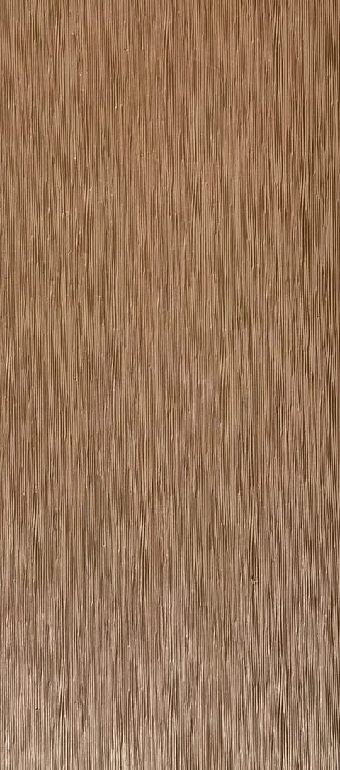 UltraDeck LuxNature composite decking board face in Teak, a warm tan with a sanded matt grain, shown as a full-length swatch strip