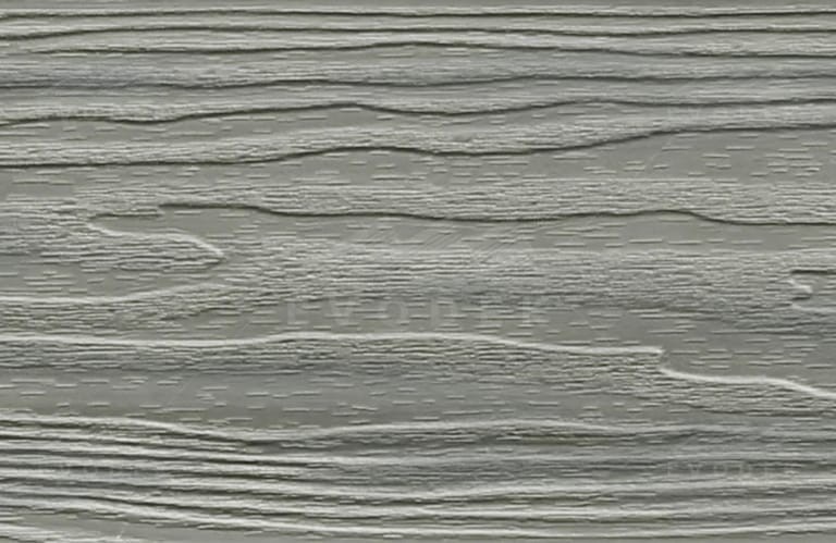 EVODEK Smoke Grey colour sample: capped composite board surface with deep embossed wood grain in light grey