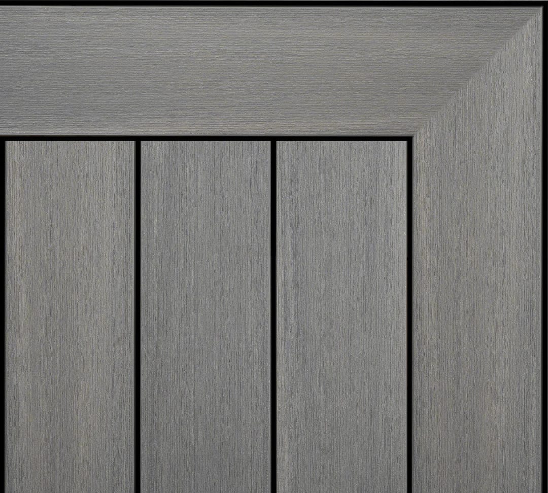 Ekodeck Essentials composite decking boards in Moonlight, a light grey, laid with a mitred edge board