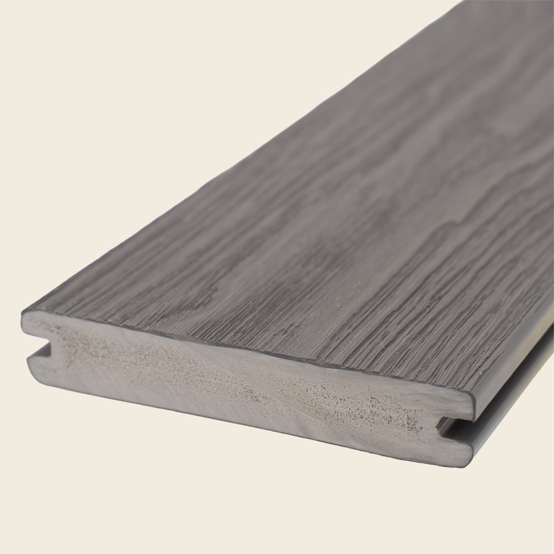 WoodEvo ADVANCED grooved PVC decking board in Smoked Ash, a mid grey-brown with embossed grain, shown end-on