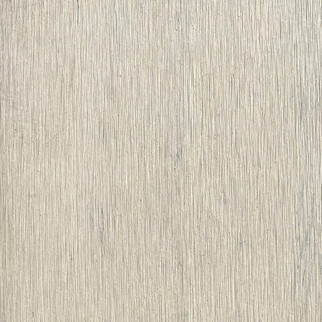 Close-up of PermaTimber American Oak decking surface, a pale greige with a fine sanded grain