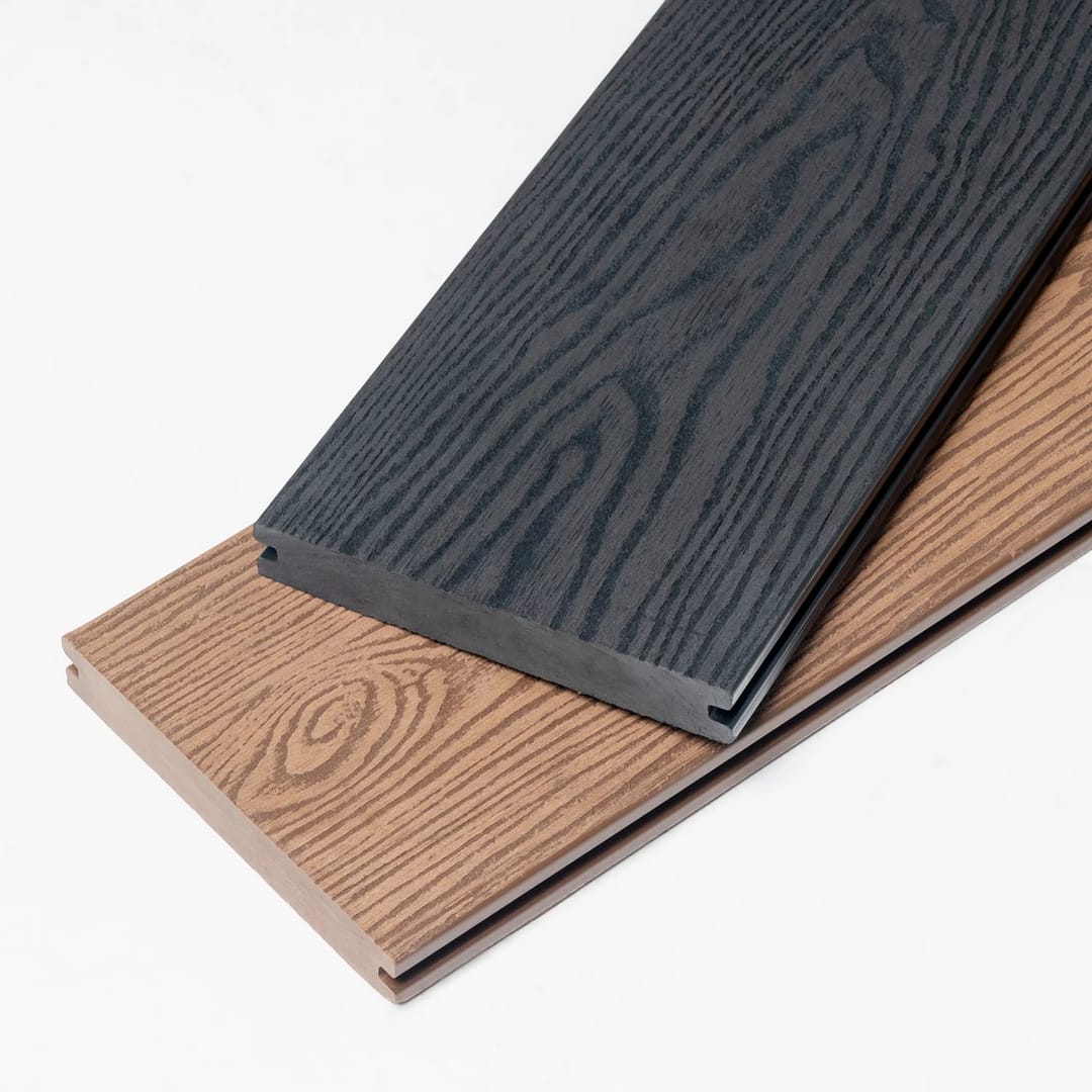 Two PureSolid Classic Solid composite boards, one charcoal and one teak, showing 3D embossed grain and grooved edges
