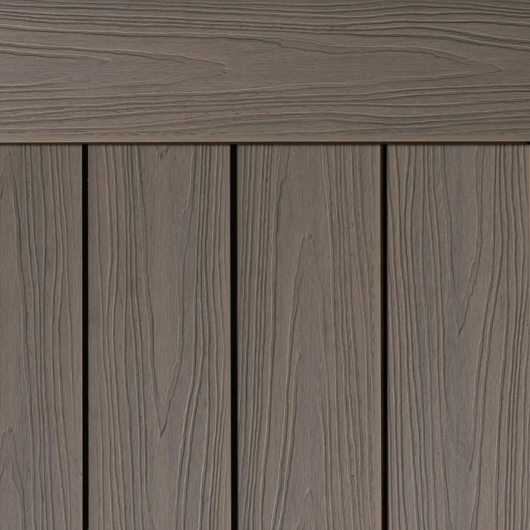 Ekodeck Flame Fighter composite decking boards in Sand Dune, a warm greige, laid with an edge board