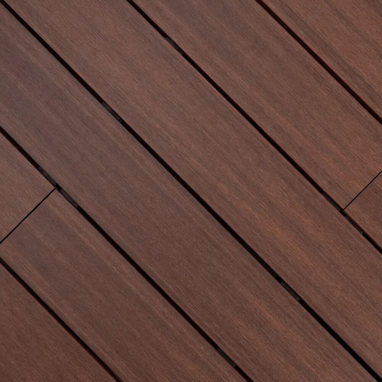 Close-up of Outdure ResortDeck Havana composite deck boards laid on the diagonal, in rich brown